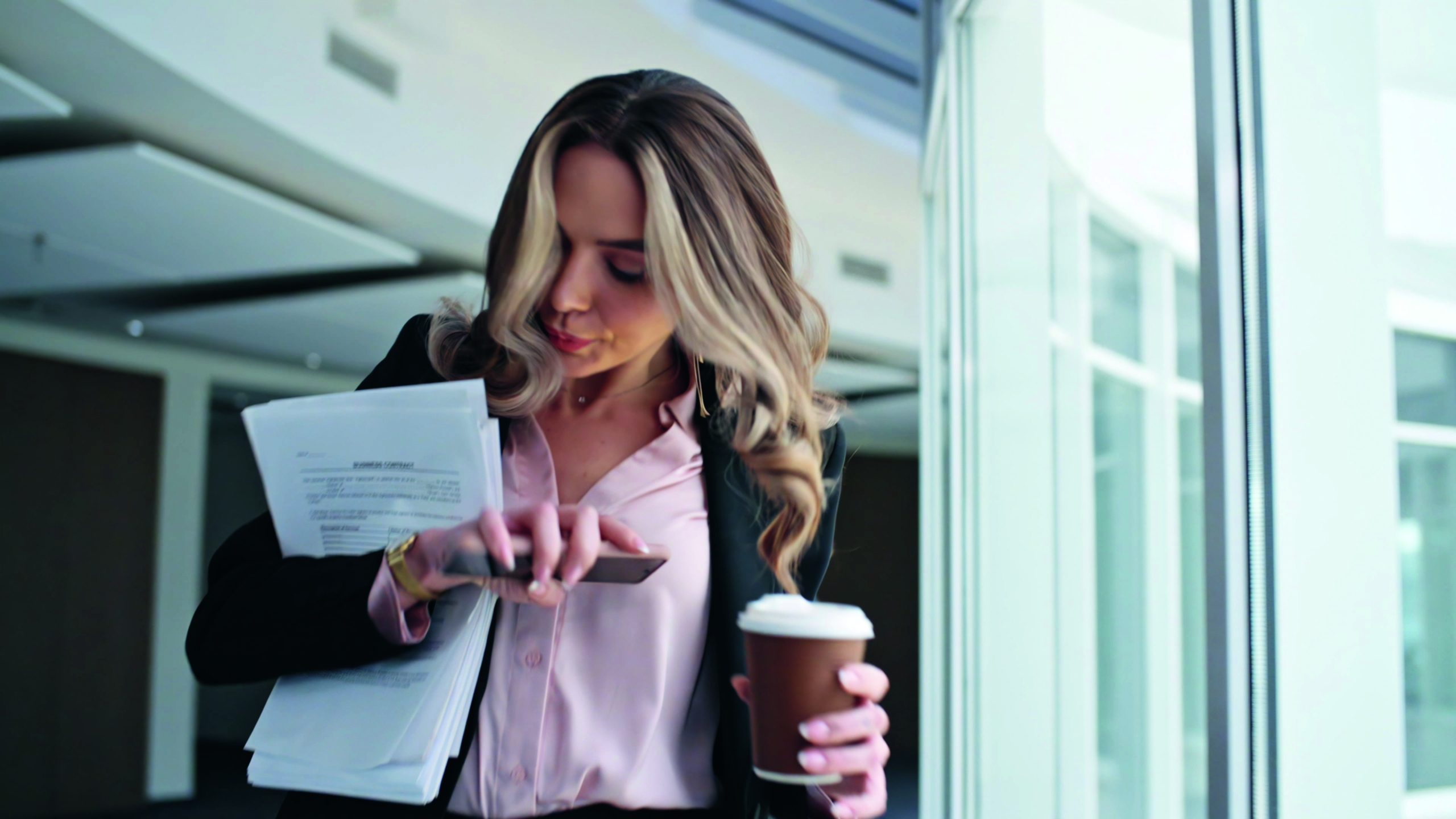 Busy woman going office hallway closeup. Late manager answering mobile phone